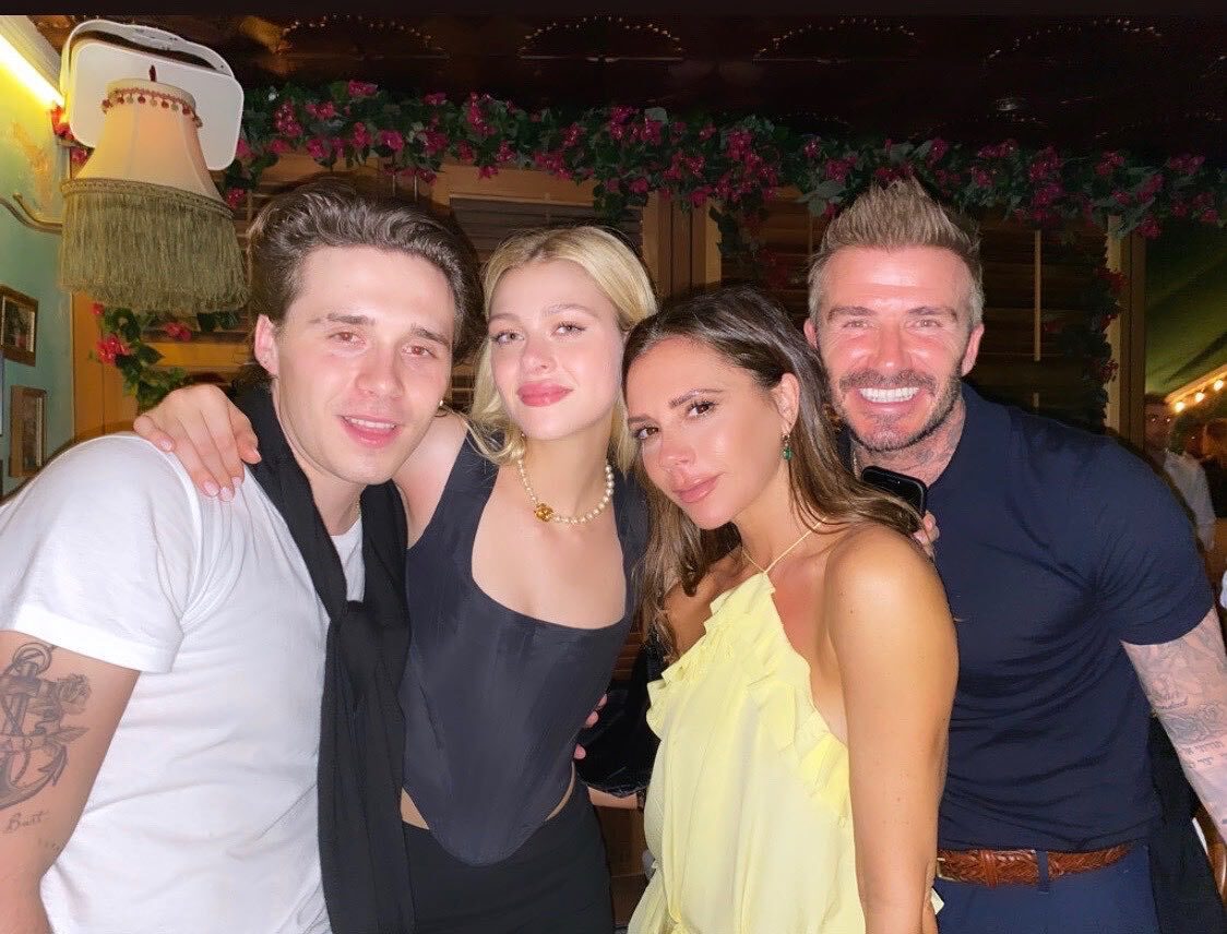 Brooklyn Beckham shares intimate bed snaps with Nicola Peltz as dad David plays happy family amid feud