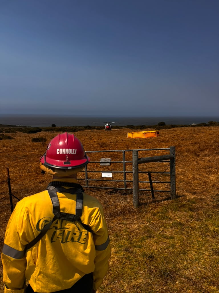 New wildfire explodes near site of massive California blaze as dozens evacuated from their homes