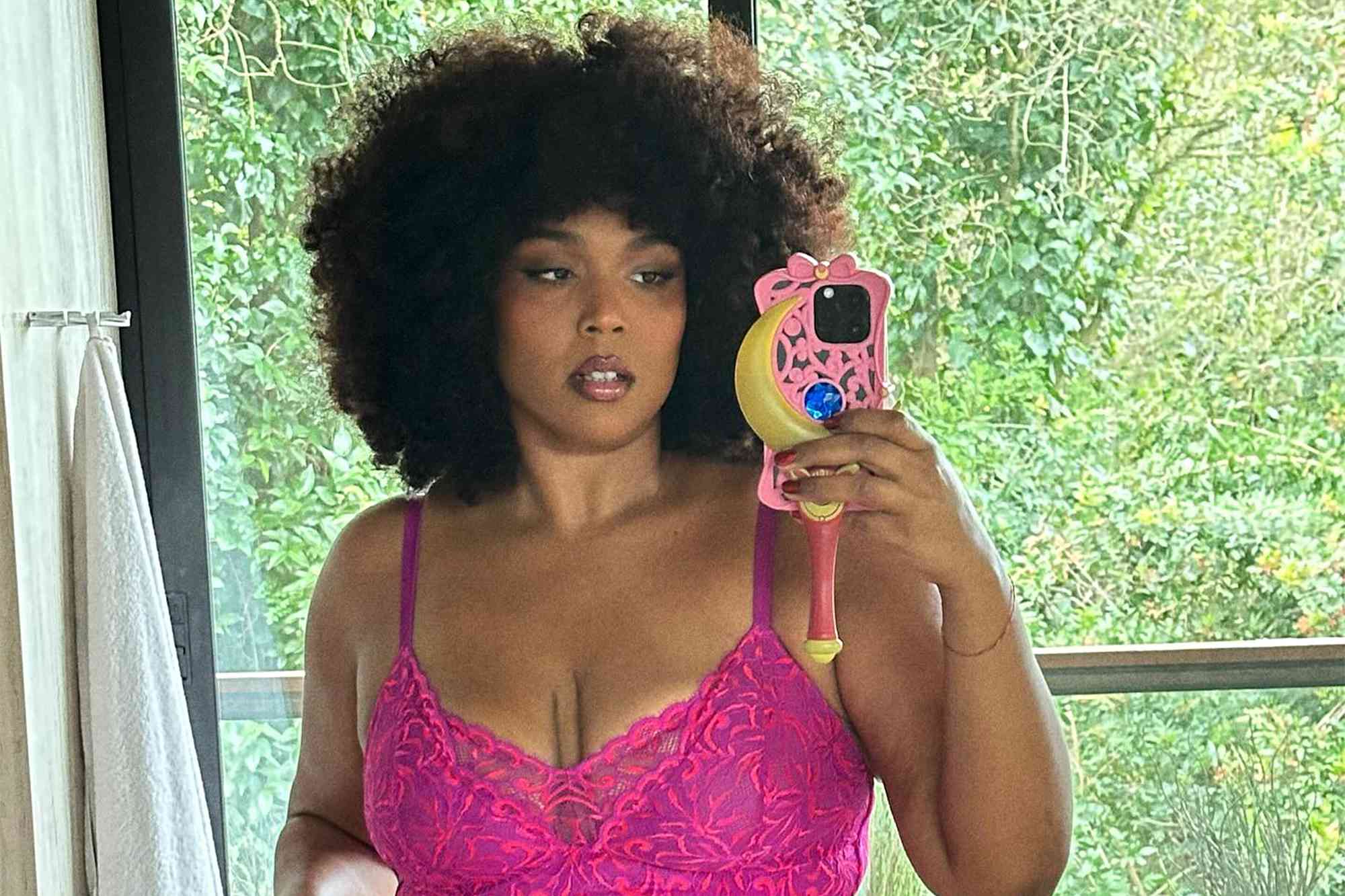Lizzo rings in ‘Fat Liberation Month’ in a teeny purple string bikini