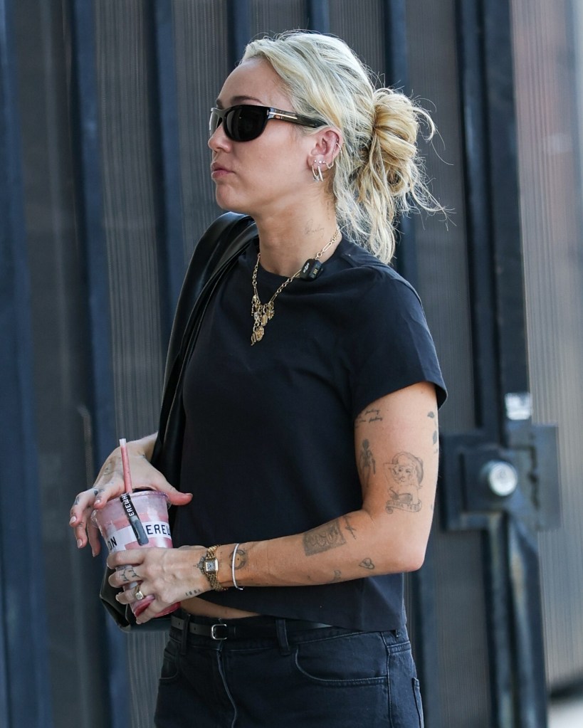 Somber Miley Cyrus arrives at LA studio in first outing since godmother Dolly Parton’s death