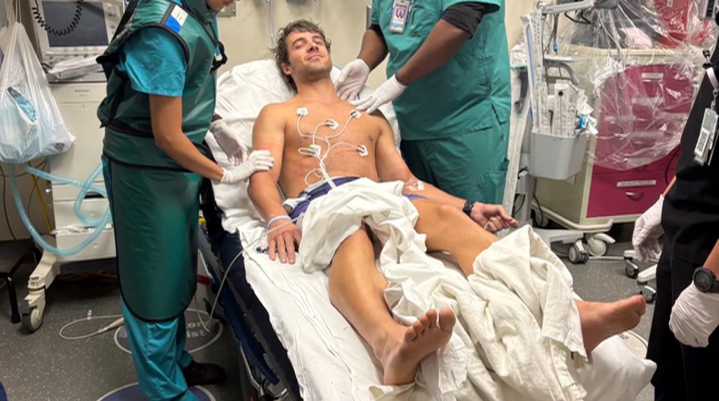 Triathlon coach, 31, savaged by alligator as beast clamped onto his arm during race training
