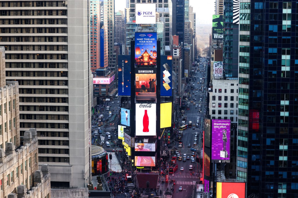 Shocking video shows wrong-way BMW racing off, hurling armed cop to ground in Times Square