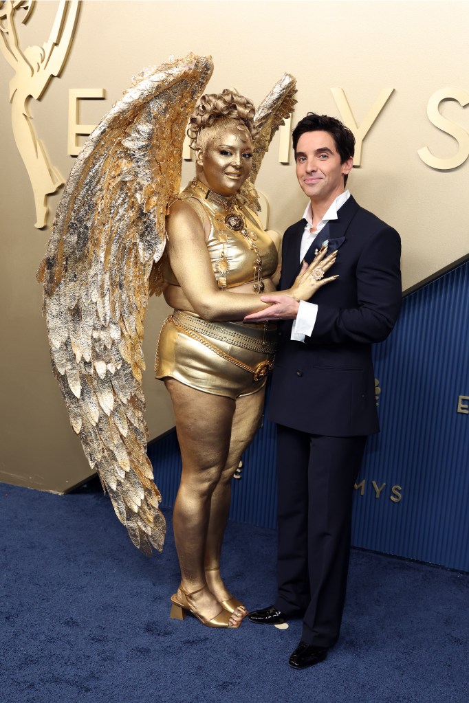 Meg Stalter is a life-sized Emmys 2026 statuette on the red carpet