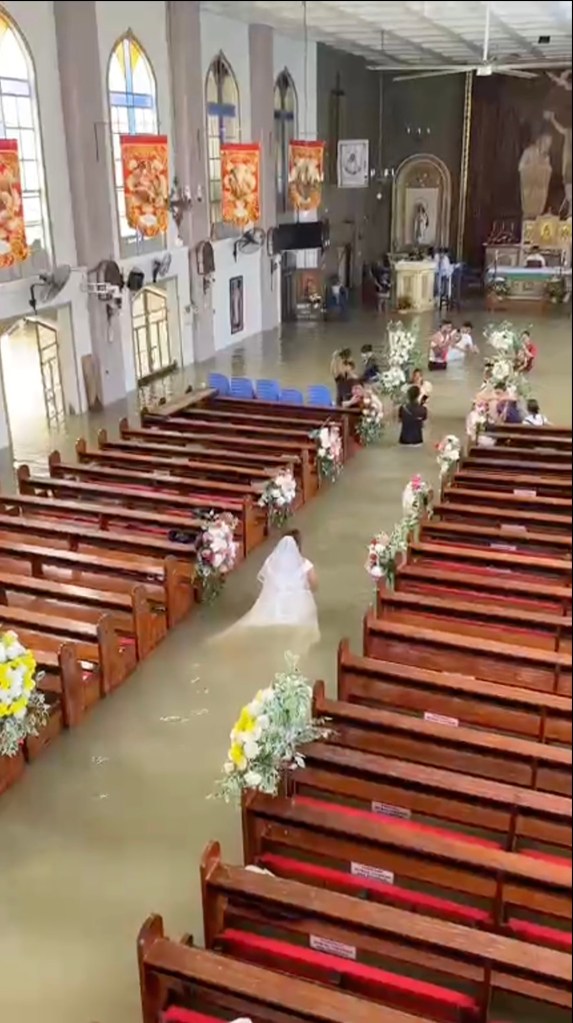 Bride refuses to let flooded church dampen her big day — gets hitched in waist-high water