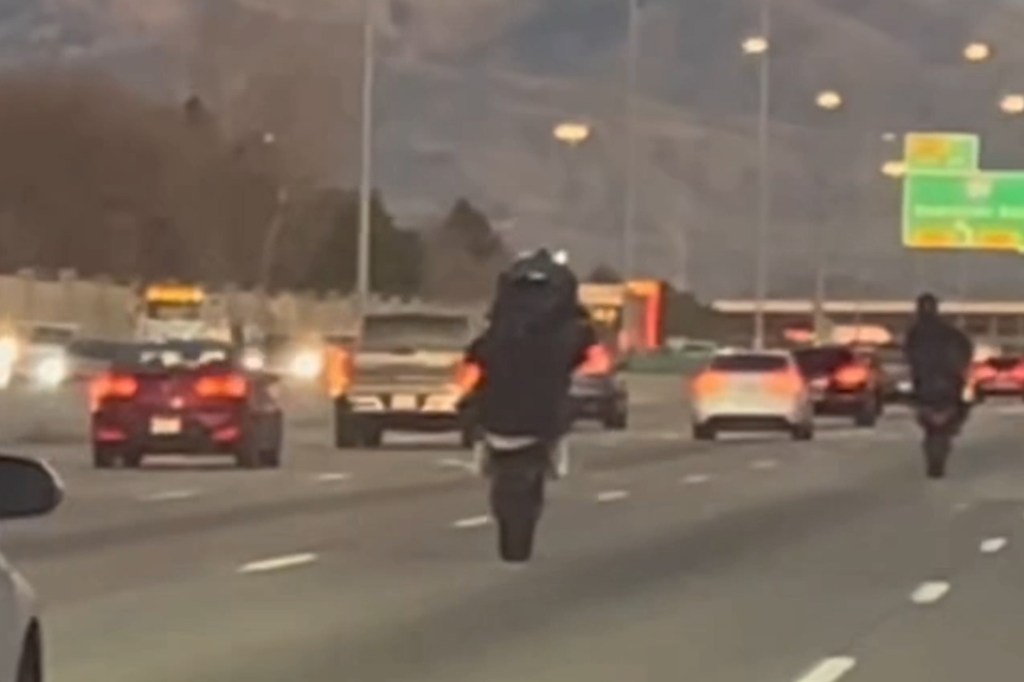 Instant karma for motorcyclist showing off on busy highway