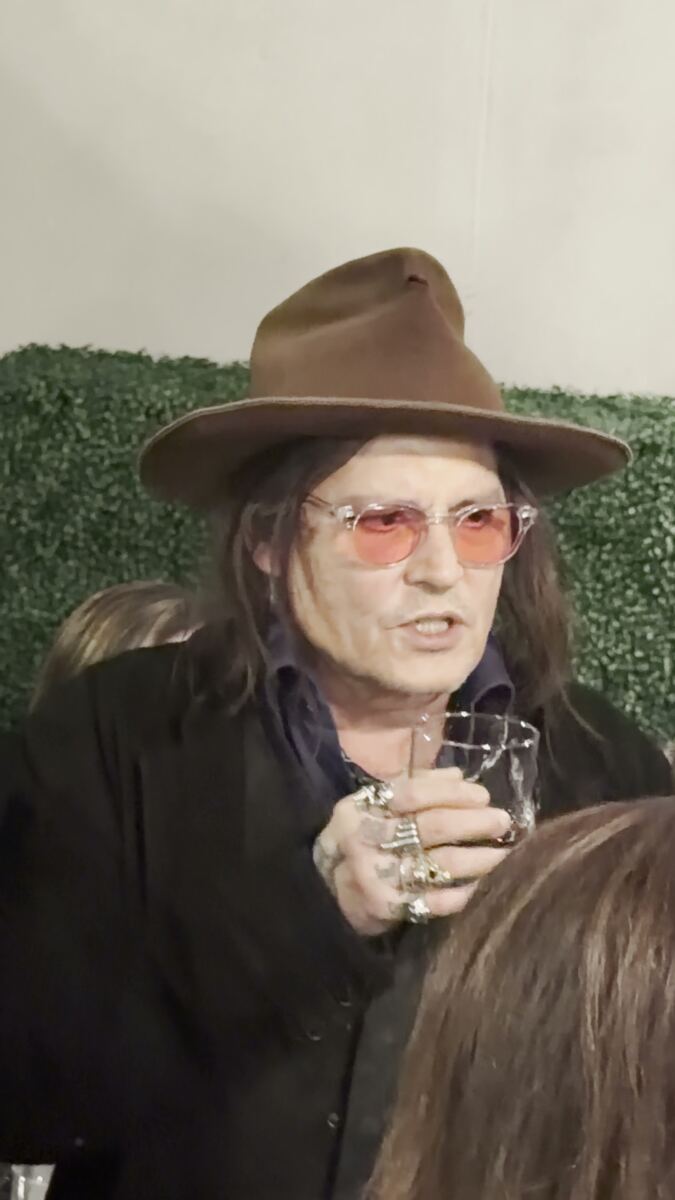 Johnny Depp eats decorative plant at Las Vegas party in bizarre video