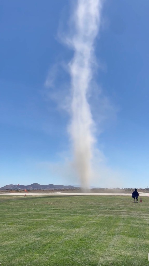 Terrifying moment massive dust devil erupts next to paragliders in California