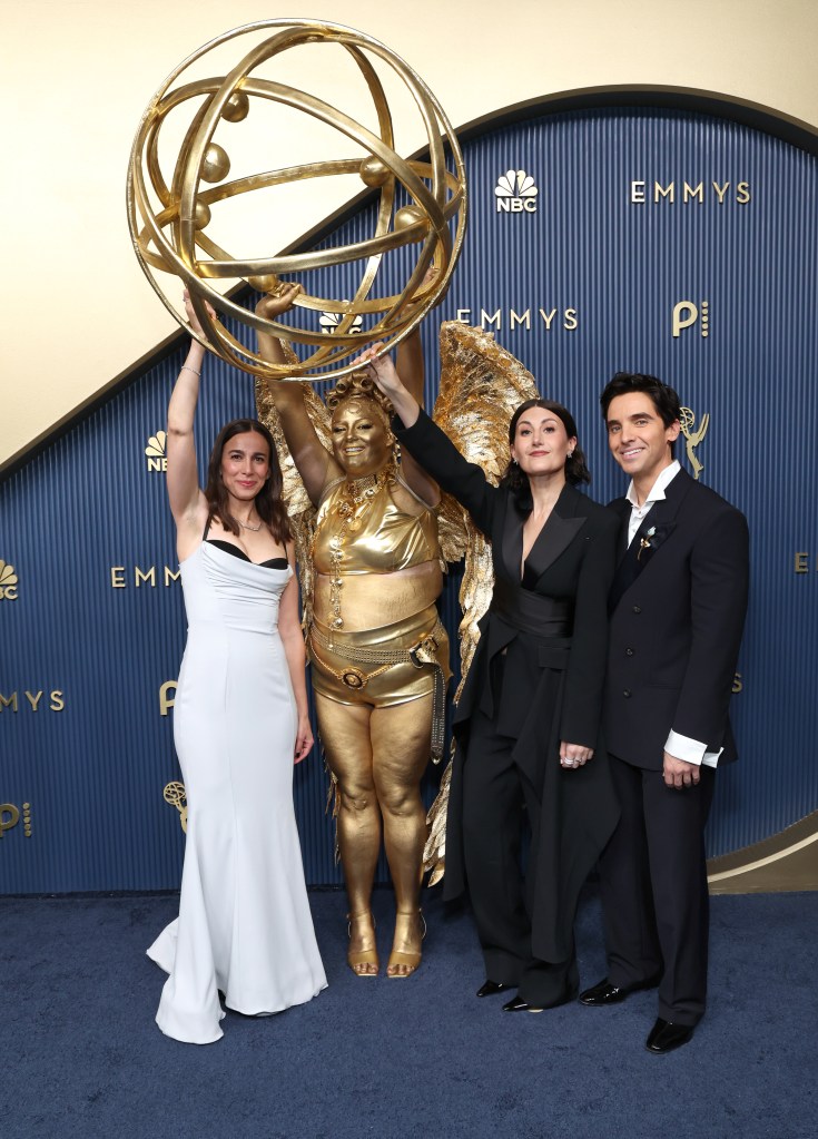 Meg Stalter is a life-sized Emmys 2026 statuette on the red carpet