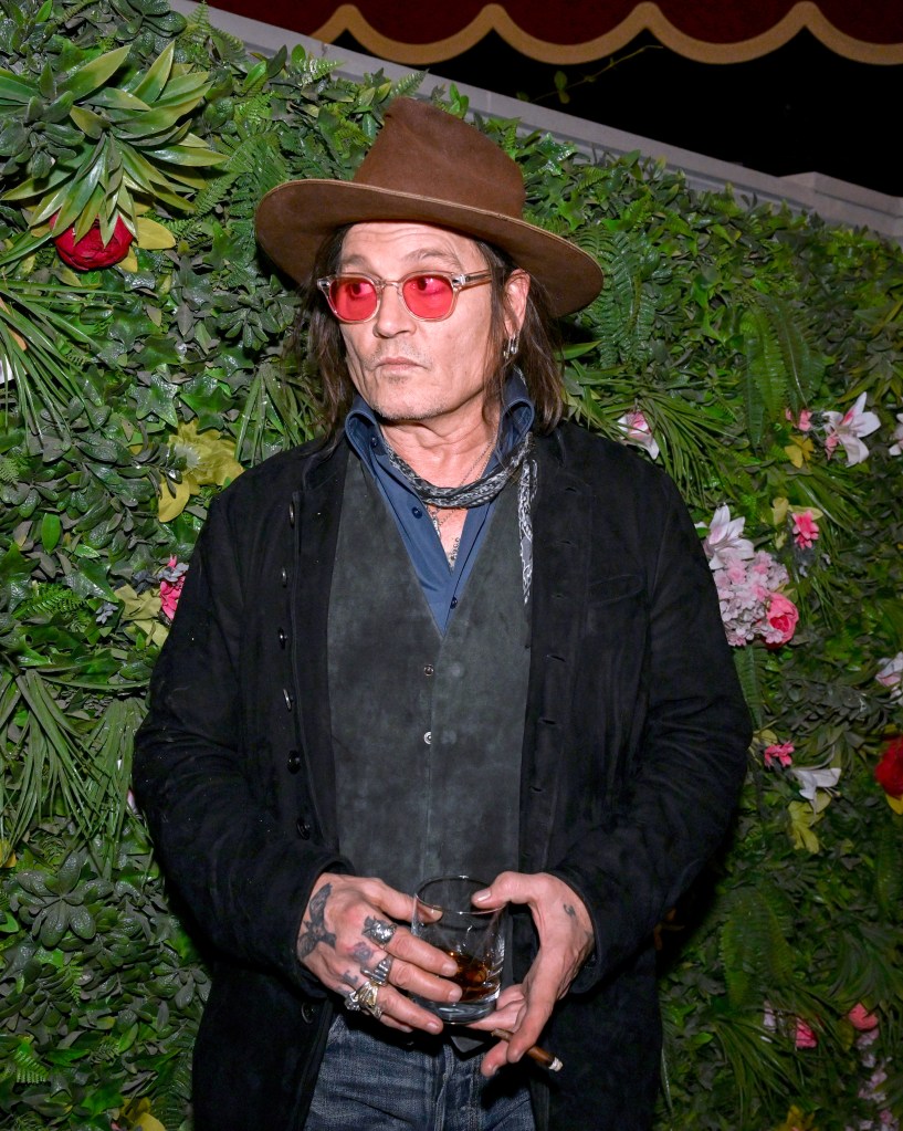 Johnny Depp eats decorative plant at Las Vegas party in bizarre video