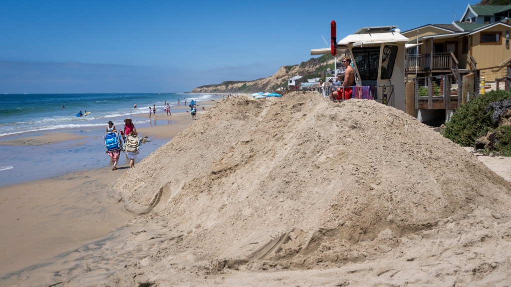 Race against time to build defenses as hurricane barrels off California