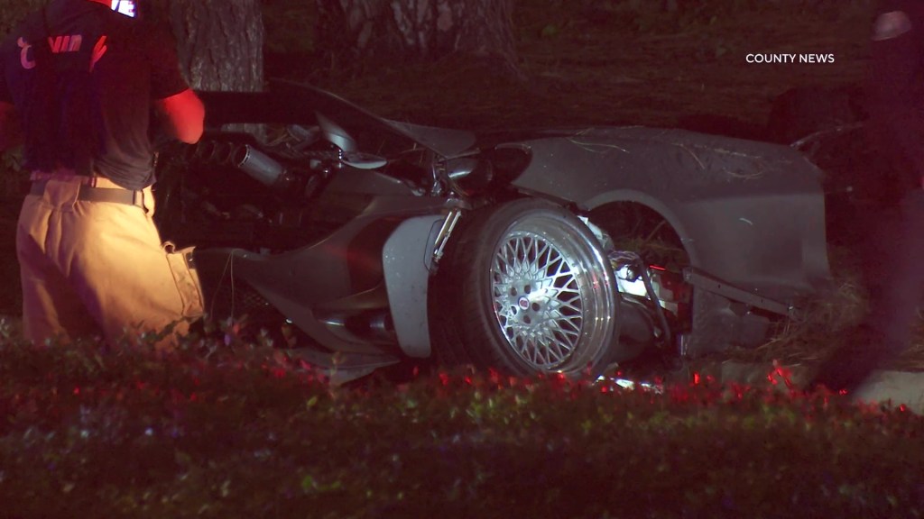 Two killed in supercar crash as McLaren smashes into tree and bursts into flames