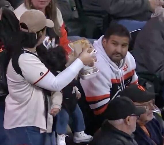 Giants ‘mom of the year’ broadcast moment goes viral because of lazy man beside her: ‘Smack him!’