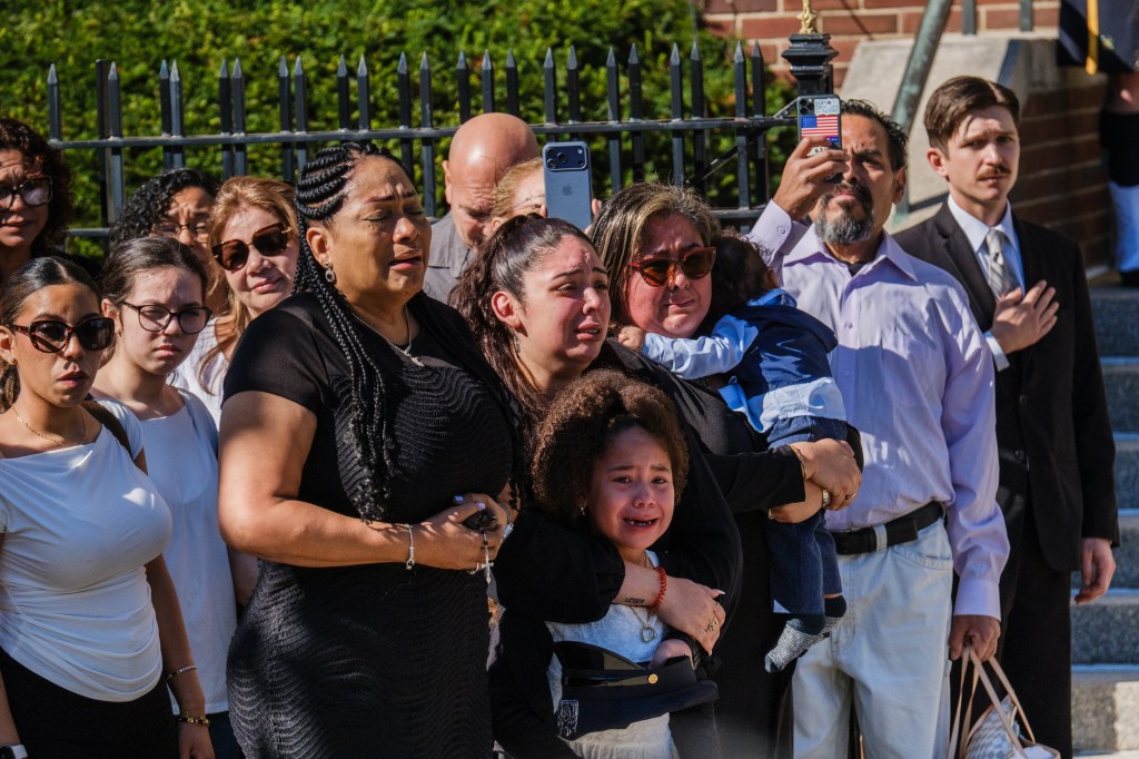 Heartwrenching funeral photos capture tearful young daughter of NYPD recruit who collapsed during run at Police Academy