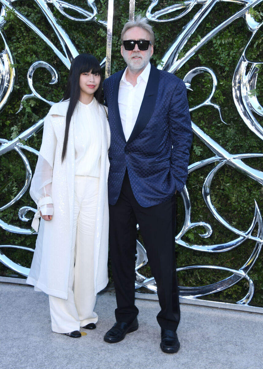 Barely recognizable Nicolas Cage, 62, sports gray beard in rare red carpet appearance with much-younger wife Riko Shibata, 31