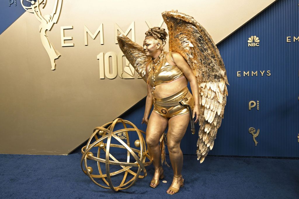 Meg Stalter is a life-sized Emmys 2026 statuette on the red carpet