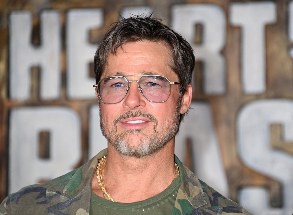 Brad Pitt gets into character in camo suit at ‘Heart of the Beast’ premiere