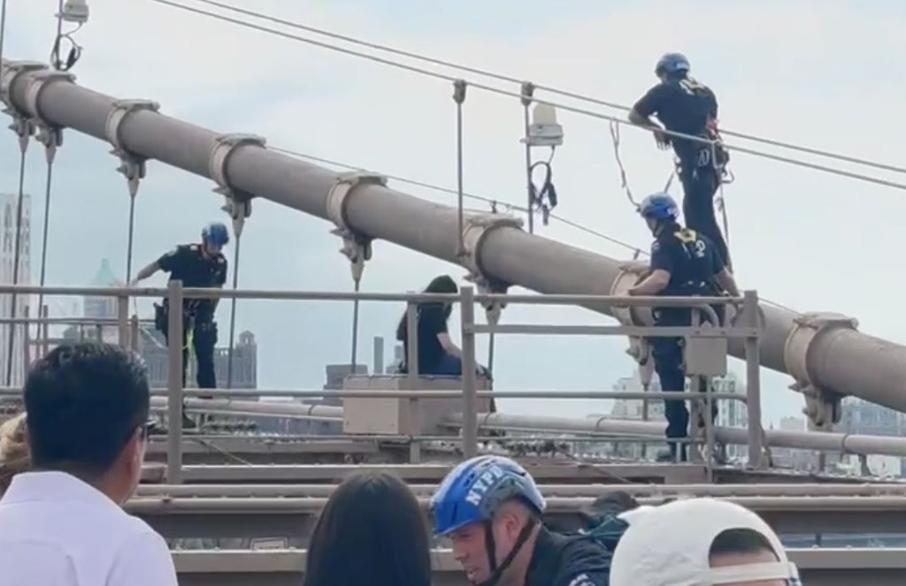 NYPD heroically rescues woman about to jump off Brooklyn Bridge, harrowing video shows