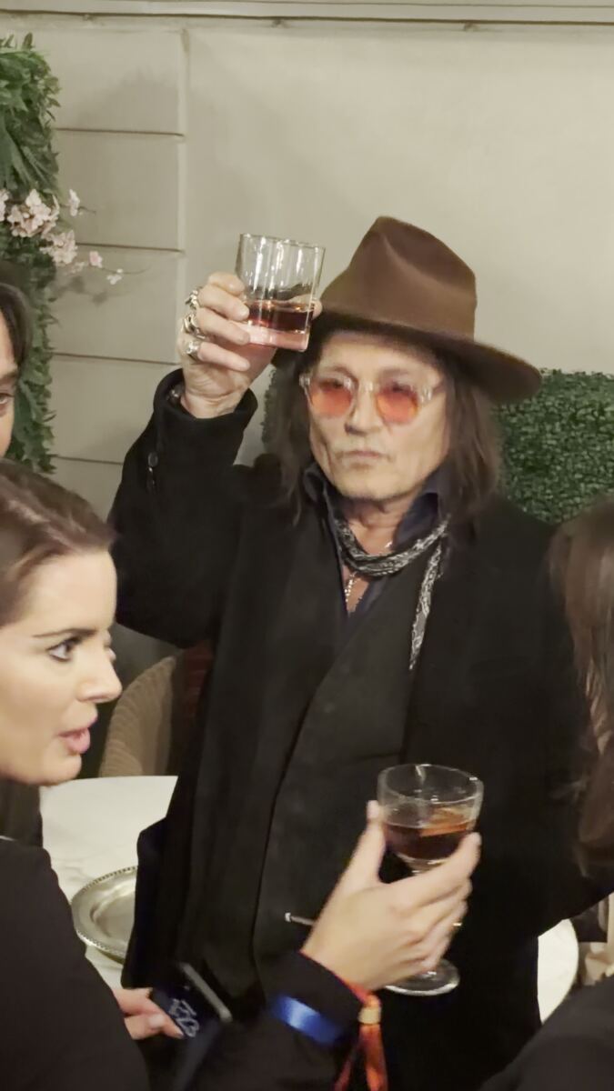 Johnny Depp eats decorative plant at Las Vegas party in bizarre video