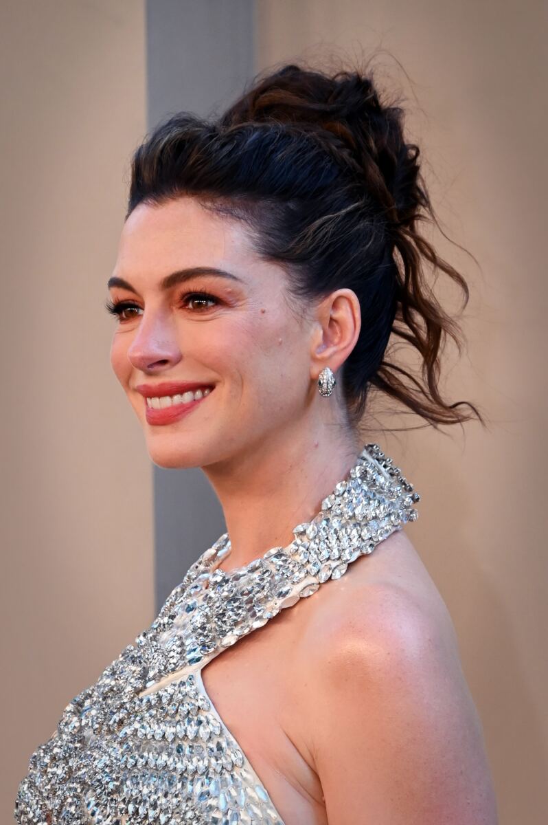 Lip readers break down what Dakota Johnson said to Anne Hathaway when she took charge on red carpet