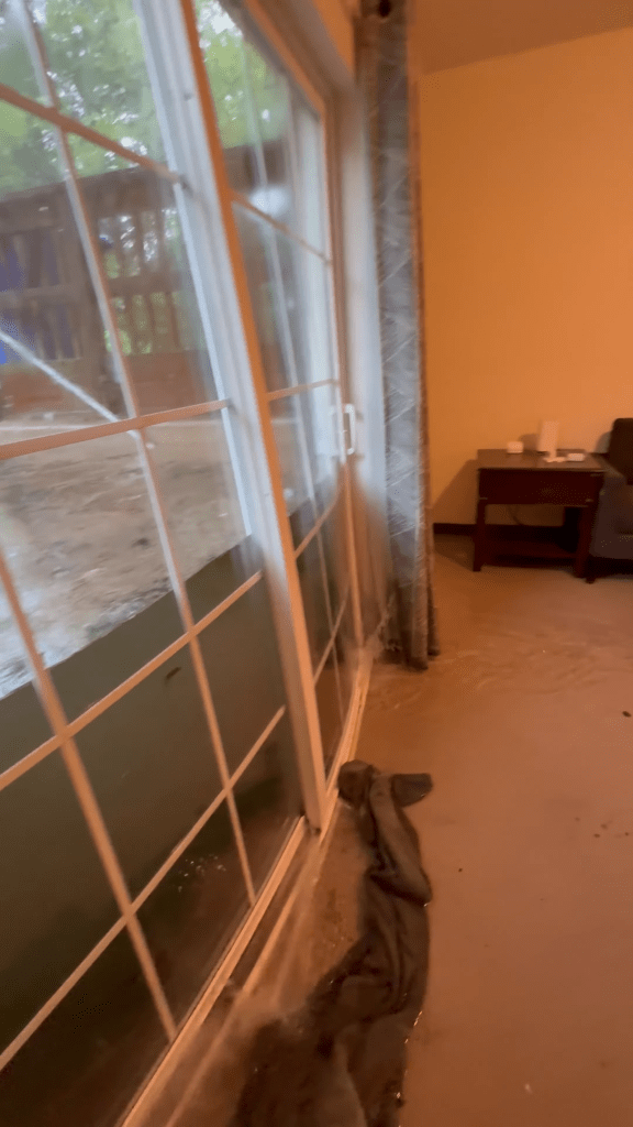 Dramatic video captures floodwaters bursting through glass doors of college students’ home
