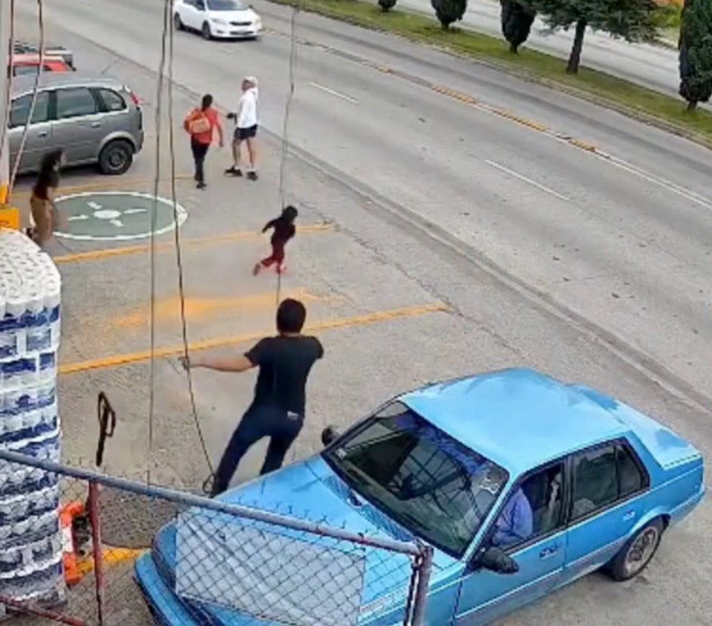 Heart-stopping video shows hero supermarket manager run into traffic to save little girl