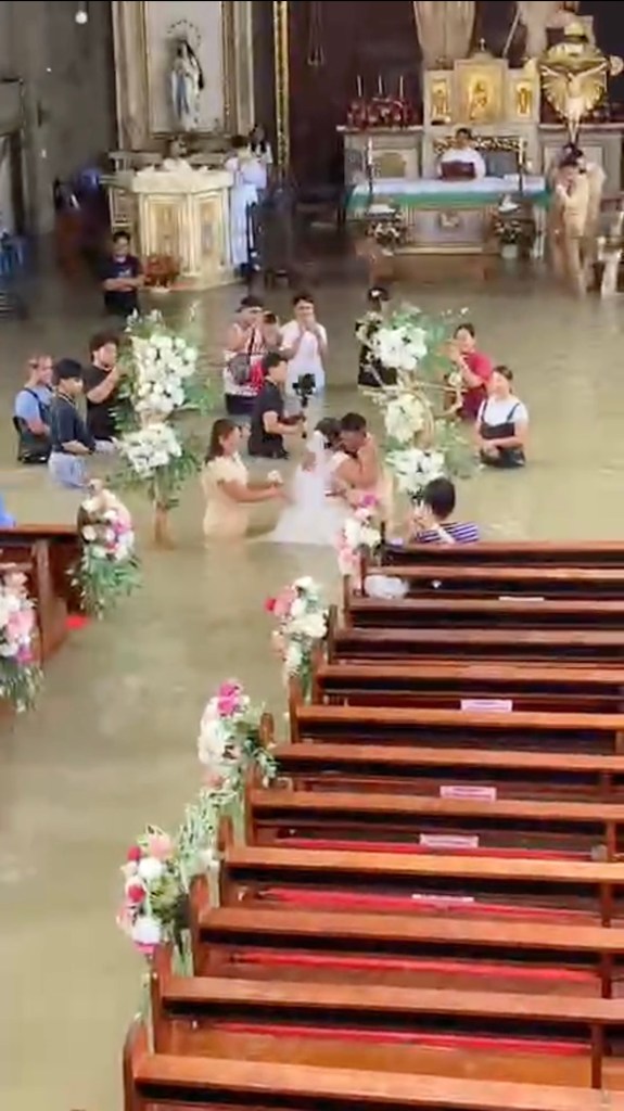 Bride refuses to let flooded church dampen her big day — gets hitched in waist-high water
