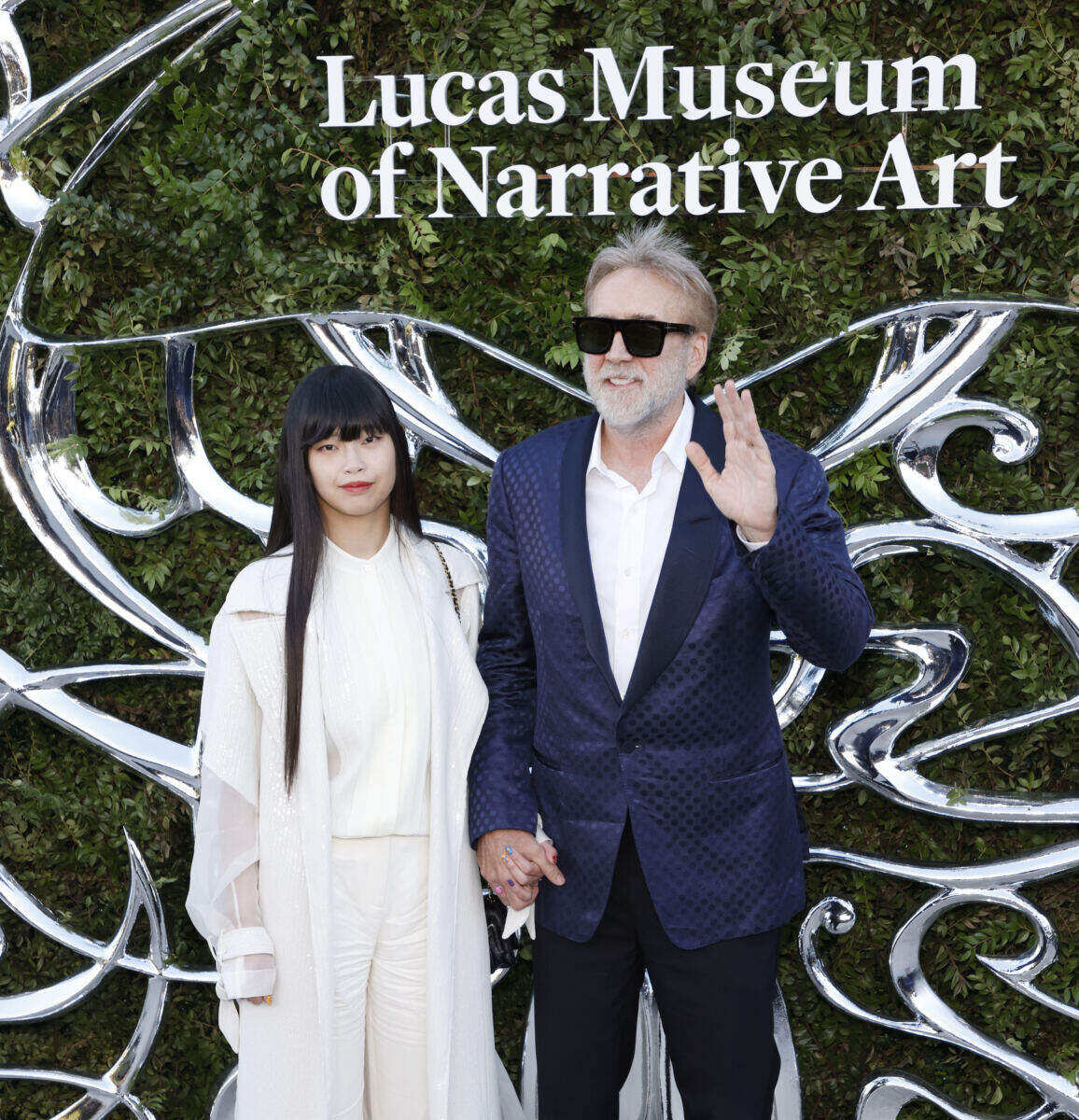 Barely recognizable Nicolas Cage, 62, sports gray beard in rare red carpet appearance with much-younger wife Riko Shibata, 31