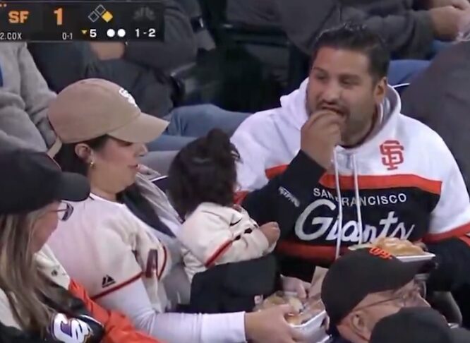 Giants ‘mom of the year’ broadcast moment goes viral because of lazy man beside her: ‘Smack him!’