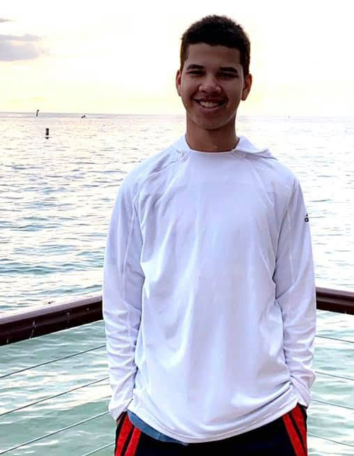 Nurse found dead alongside two adult sons in suspected double murder-suicide