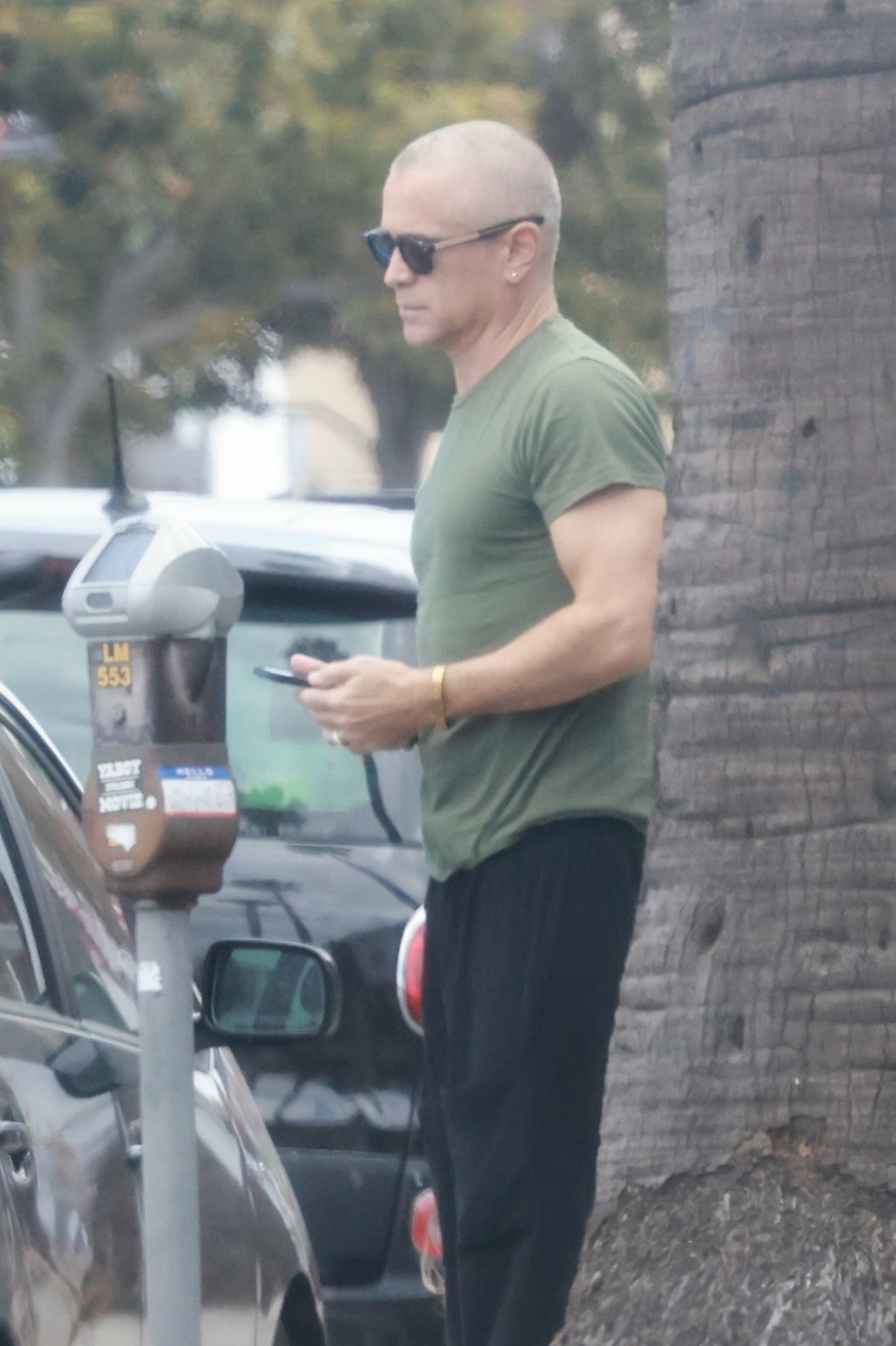 Colin Farrell shocks with newly shaved head in LA