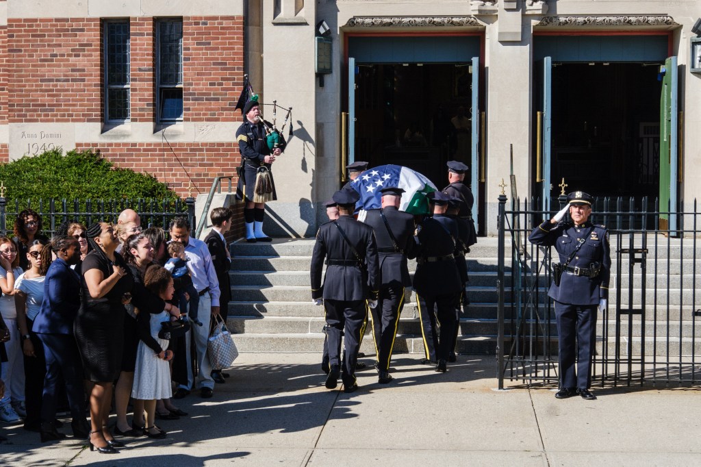 Heartwrenching funeral photos capture tearful young daughter of NYPD recruit who collapsed during run at Police Academy