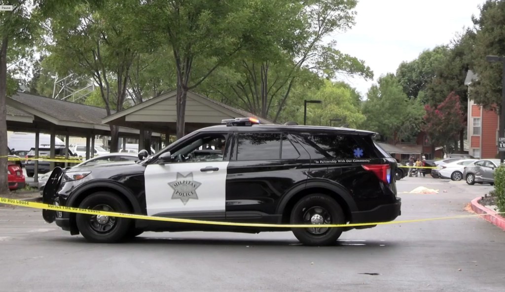 Woman accused of intentionally running over friend in chilling parking-lot murder as another pal turns up stabbed in double-death mystery
