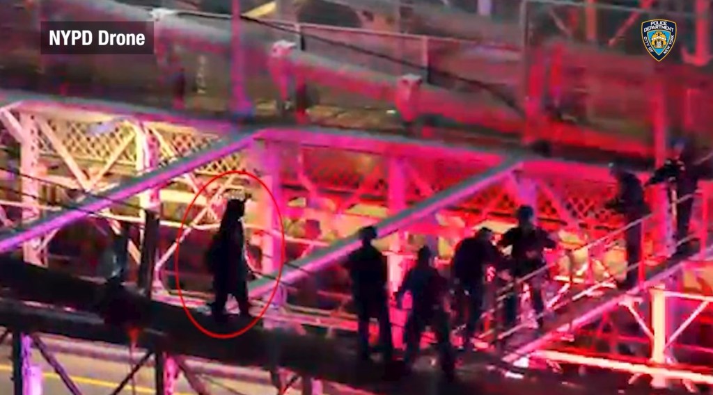 Drone footage captures moment police fatally shoot knife-wielding nut — as he lunges at them from atop the Brooklyn Bridge