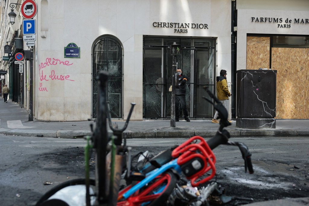 French rioters target Louis Vuitton, Hermes and Apple stores — as lux brands hire their own guards