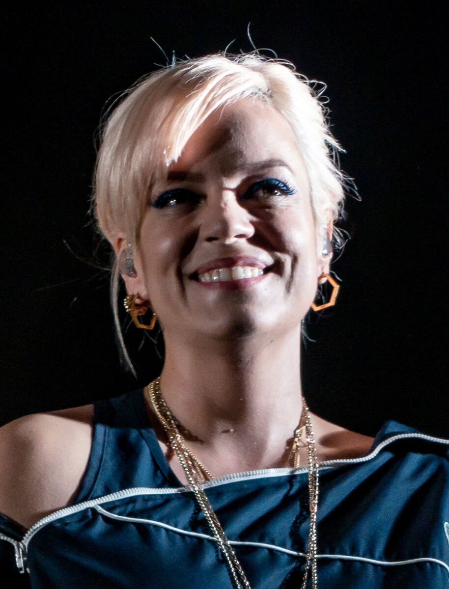Lily Allen tops her see-through lace catsuit with a sparkling Chanel jacket