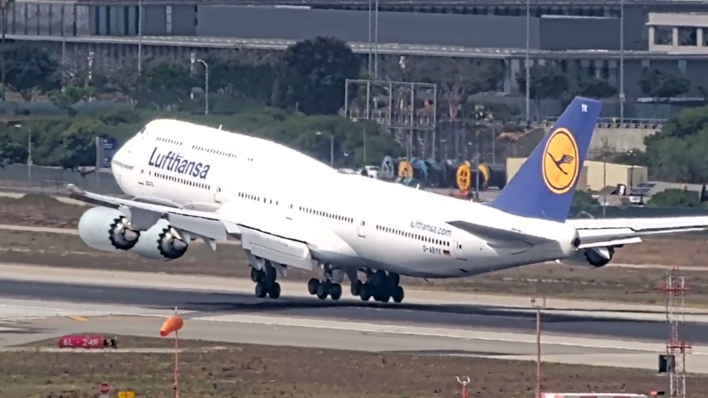 Terrifying moment massive Boeing 747 bounces off runway at LAX as tail scrapes ground