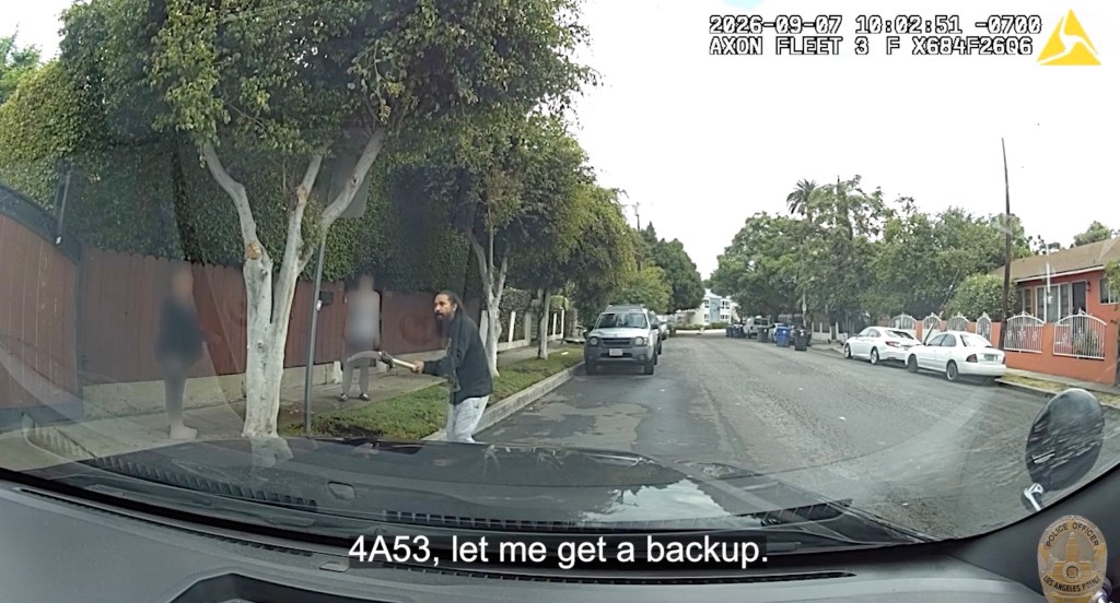Moment madman with polesaw charges cops before he’s shot dead in bloody scene