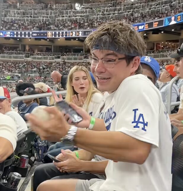 Dodgers fan’s brutal response when entire stadium demanded he hand foul ball to young Braves fan
