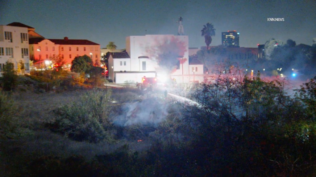 Fast-moving wildfire breaks out in Los Angeles overnight as winds rage