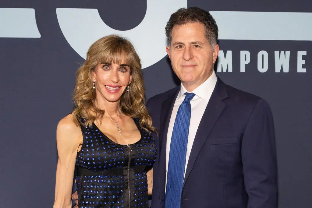 Jaw-dropping net worth of 'woman in the red dress' Susan Dell after her awkward interaction with Trump