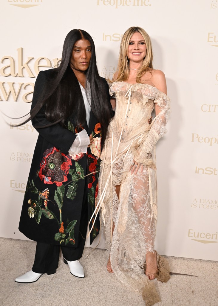 Heidi Klum’s tattered, stained lace corset gown looks like it survived a shipwreck