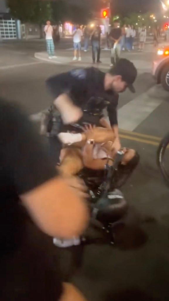 Viral video captures Arizona State University cheerleader being shoved to ground, pummeled by cops