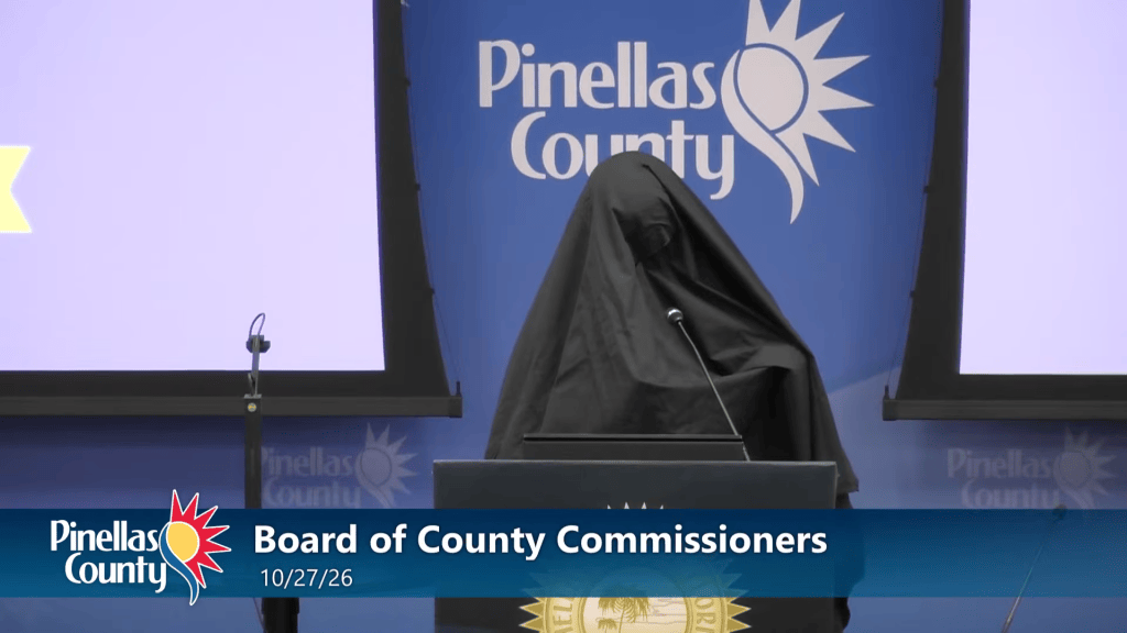 Woman wearing burka escorted out of Florida county meeting after playing call to prayer recording