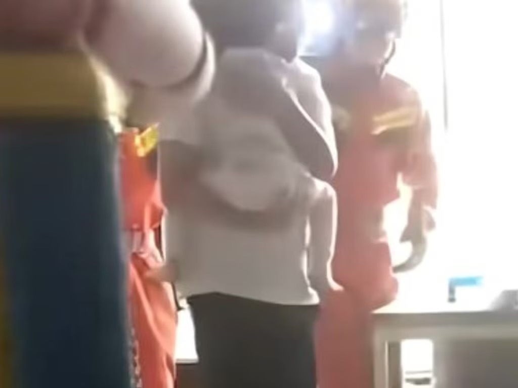 Neighbors race to save child dangling from 12th-floor window, dramatic video shows