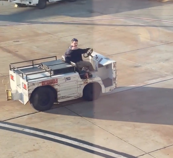 Wild moment unhinged man steals airport tow vehicle for joyride around tarmac at California airport — as maniac is unmasked