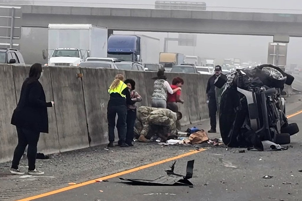 Woman allegedly stabs girl after SUV hits semi as soldiers step in to stop horrific roadside attack