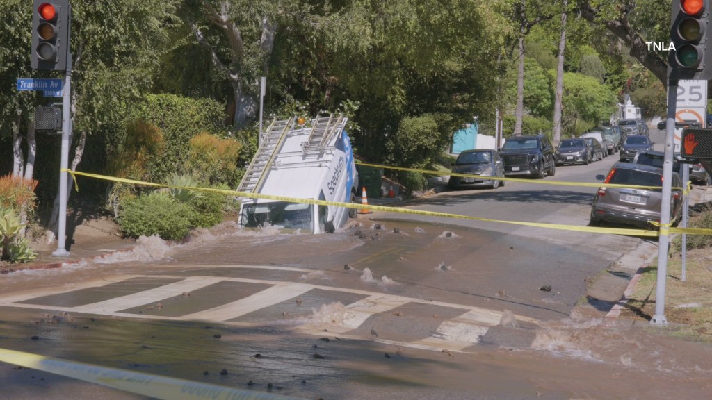 Massive sinkhole opens up on busy Los Angeles street swallowing entire van
