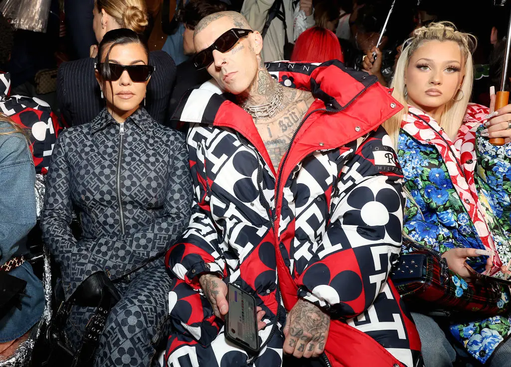 Travis Barker shares update from hospital bed and says wife Kourtney Kardashian is 'by my side'