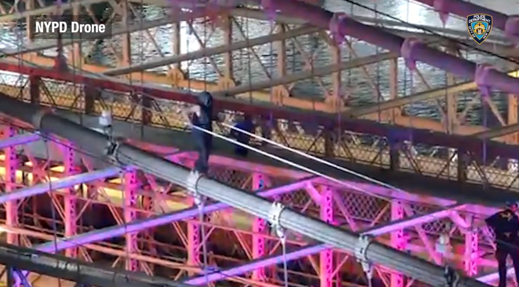 Drone footage captures moment police fatally shoot knife-wielding nut — as he lunges at them from atop the Brooklyn Bridge