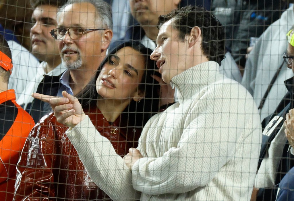 Dua Lipa sports $15K Chanel coat at Yankees playoff game with husband Callum Turner